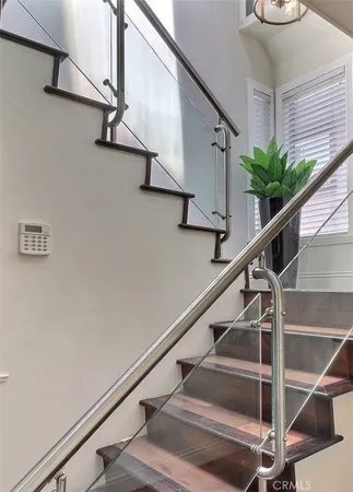 a view of entryway with wooden floor and stairs