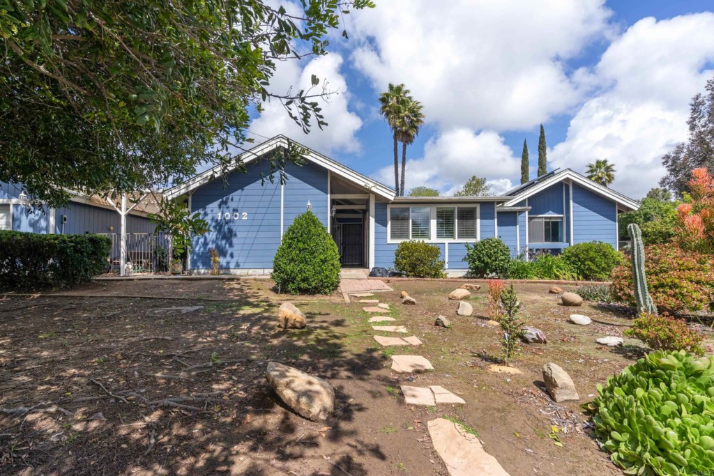 1002 Pepper Tree Lane Fallbrook, CA 92028 - Photo 1 of 1 a view of a house with a yard