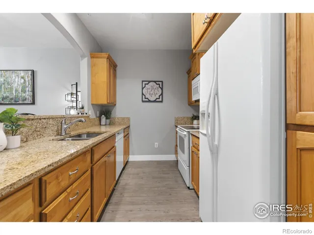 a kitchen with a sink stove and refrigerator