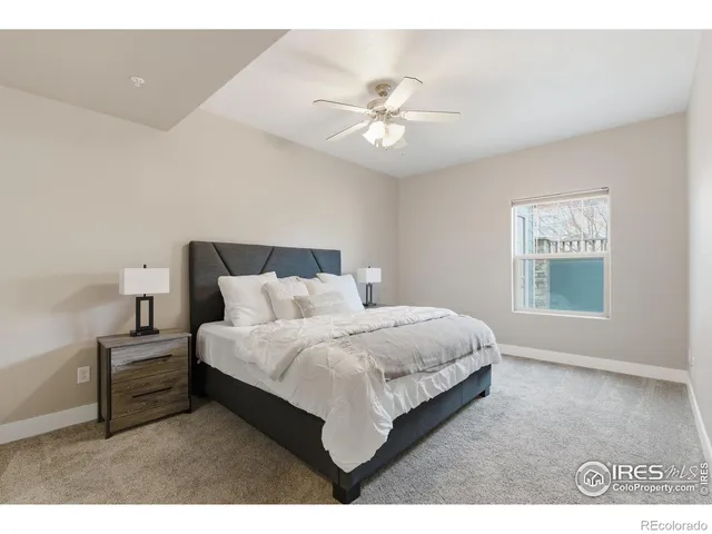 a bed room with a bed and a window