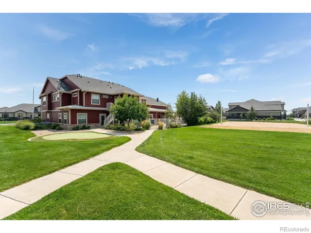 a front view of house with yard patio and outdoor seating