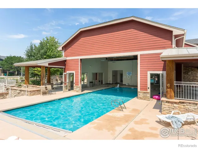 a view of a city with lawn chairs