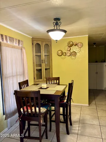 a view of a dining room with furniture and window