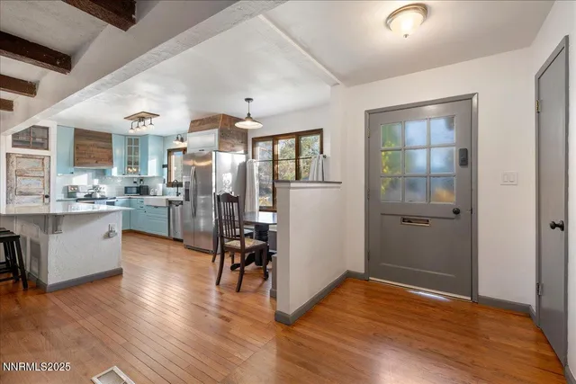 a view of kitchen with furniture and wooden floor