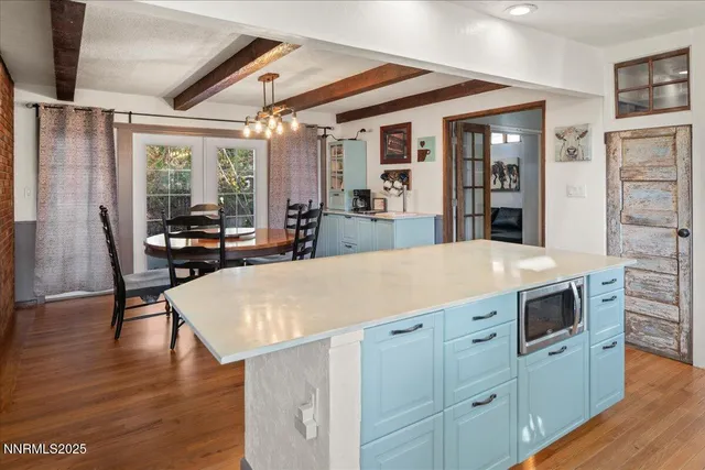 a view of kitchen with sink and wooden floor