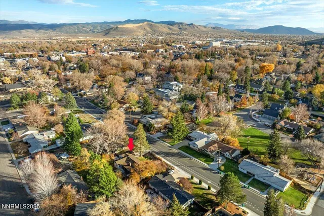 an aerial view of city and mountain