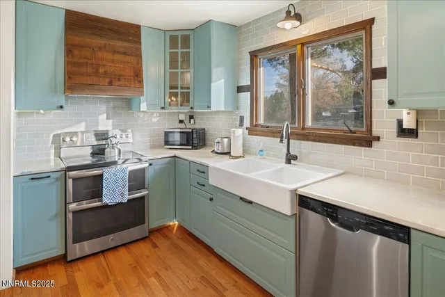 a kitchen with a sink stove and cabinets