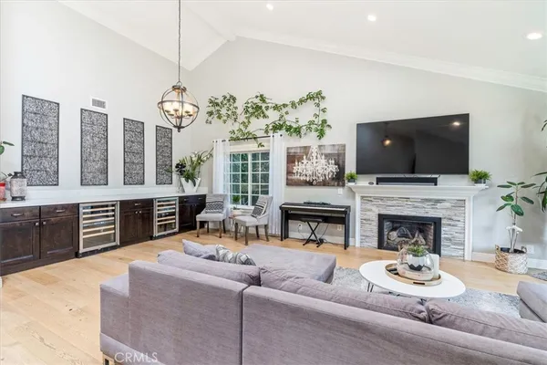 a living room with fireplace furniture and a flat screen tv