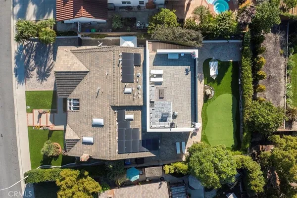 an aerial view of a house with a garden