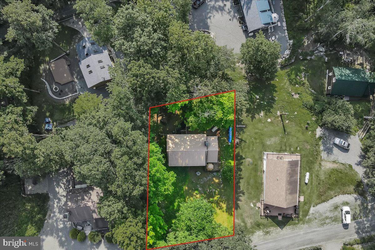 112 Beechwood Cove Road Greentown, PA 18426 - Photo 54 of 59 an aerial view of a house with a yard and lake view