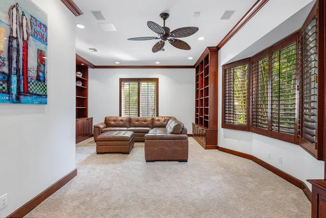 a large kitchen with granite countertop a sink and a window