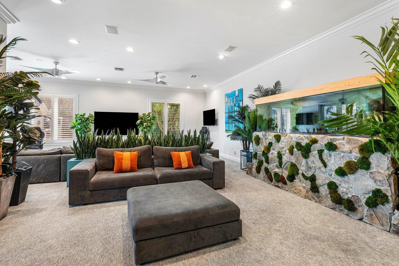 963 Eve Street Delray Beach, FL 33483 - Photo 18 of 83 a living room with furniture and a flat screen tv