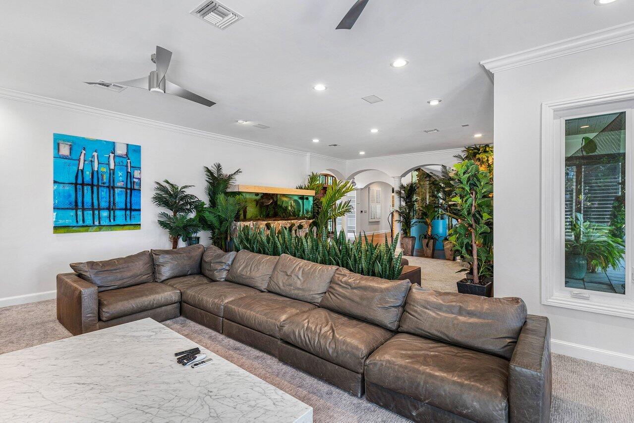 963 Eve Street Delray Beach, FL 33483 - Photo 20 of 83 a living room with furniture and a potted plant