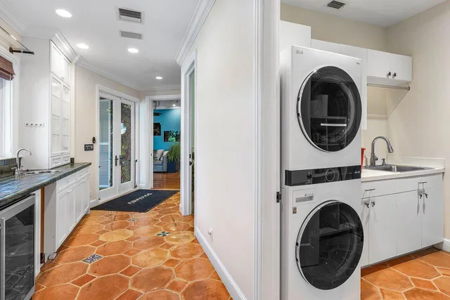 a bathroom with a granite countertop toilet a sink and a bathtub