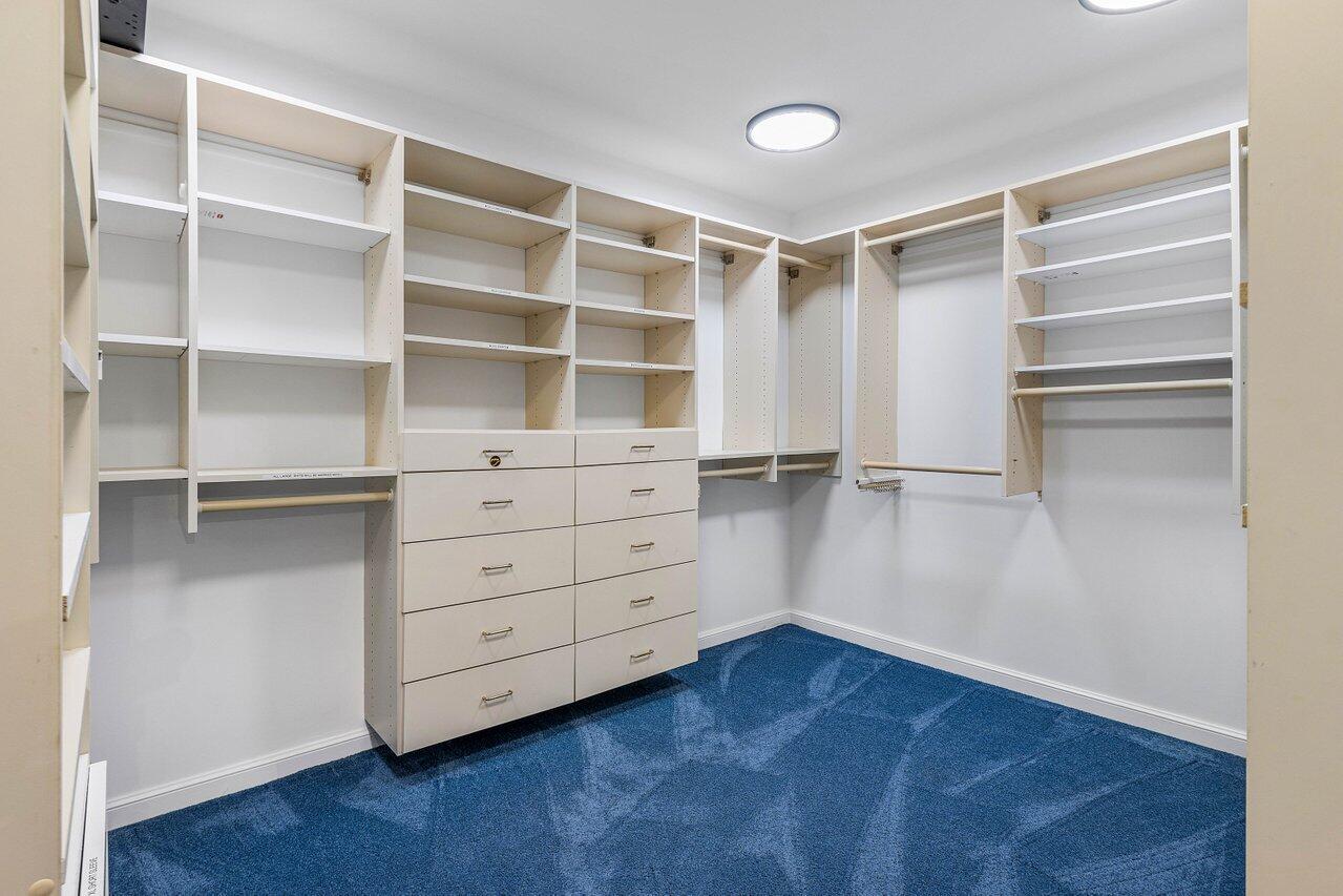 963 Eve Street Delray Beach, FL 33483 - Photo 39 of 83 a room with walk in closet and wooden floor