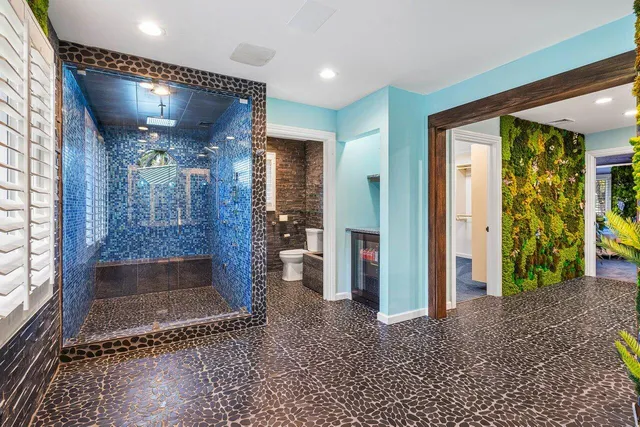 a view of a chairs and table in the back yard of the house