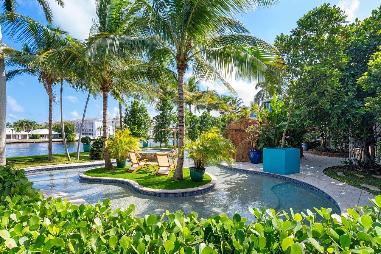 963 Eve Street Delray Beach, FL 33483 - Photo 57 of 83 a view of a yard with palm trees