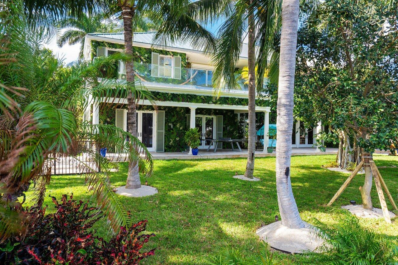 963 Eve Street Delray Beach, FL 33483 - Photo 69 of 83 a view of a house with a yard patio and swimming pool