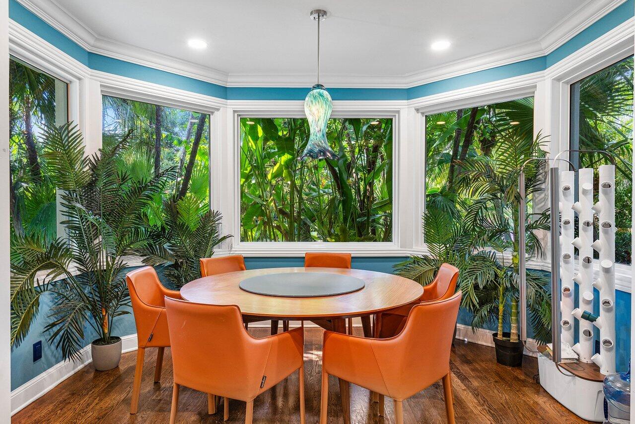 963 Eve Street Delray Beach, FL 33483 - Photo 8 of 83 a view of a dining room with furniture window and wooden floor