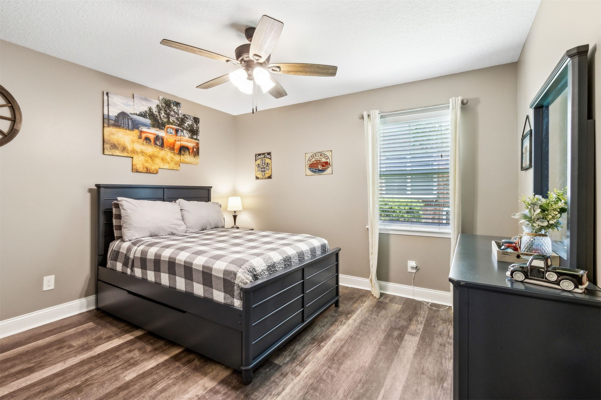 95210 Cook Road Fernandina Beach, FL 32034 - Photo 23 of 70 a bedroom with a large bed and a chandelier