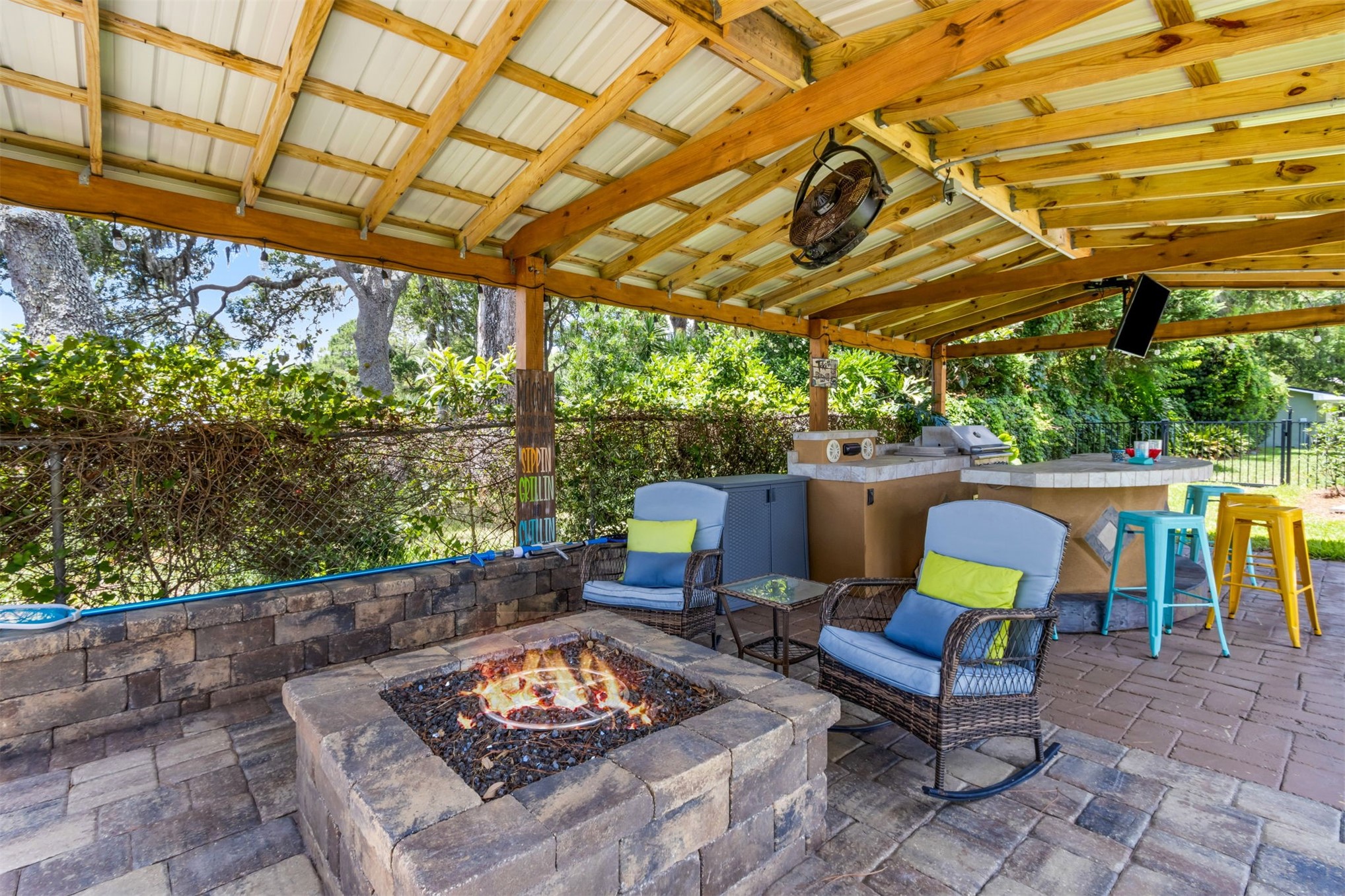 95210 Cook Road Fernandina Beach, FL 32034 - Photo 39 of 70 a backyard of a house with fountain table and chairs