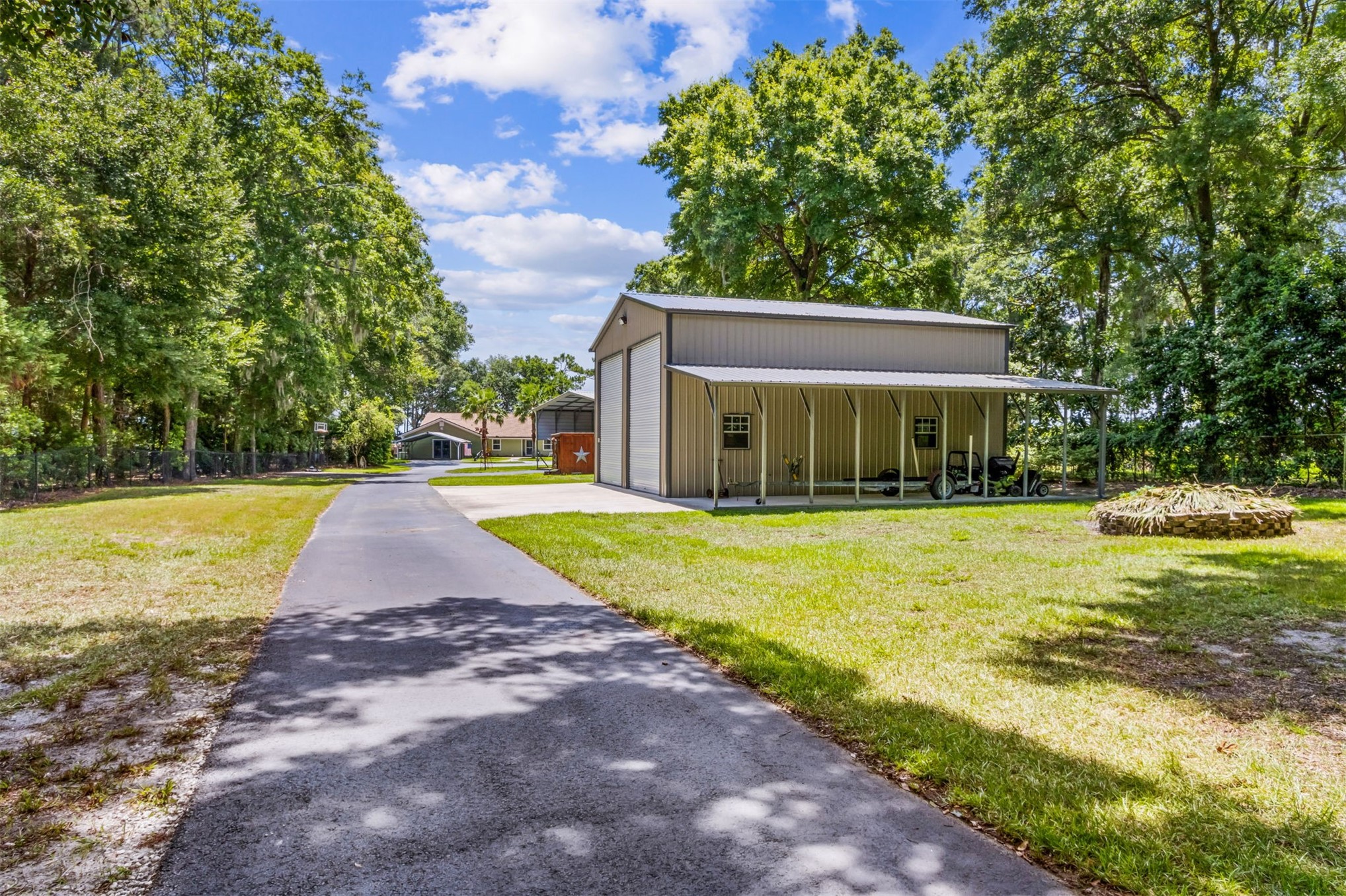 95210 Cook Road Fernandina Beach, FL 32034 - Photo 54 of 70 a view of swimming pool with lawn chairs and large trees