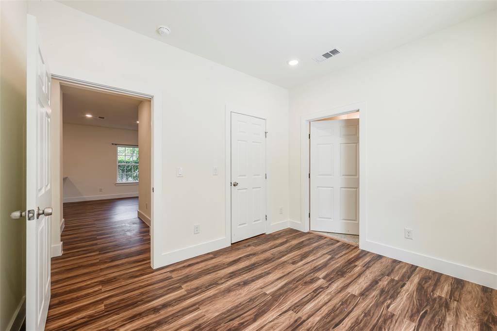 3523 Herrling Street Dallas, TX 75210 - Photo 11 of 14 Unfurnished bedroom with recessed lighting and dark wood-style flooring