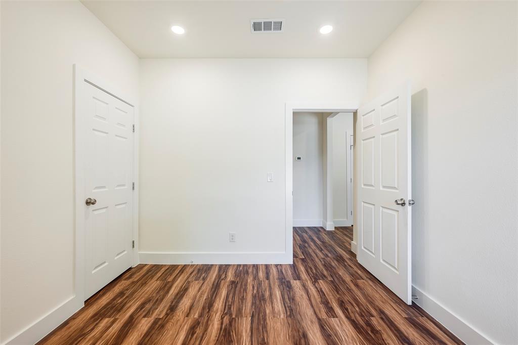 3523 Herrling Street Dallas, TX 75210 - Photo 13 of 14 Spare room with dark wood-style floors and recessed lighting
