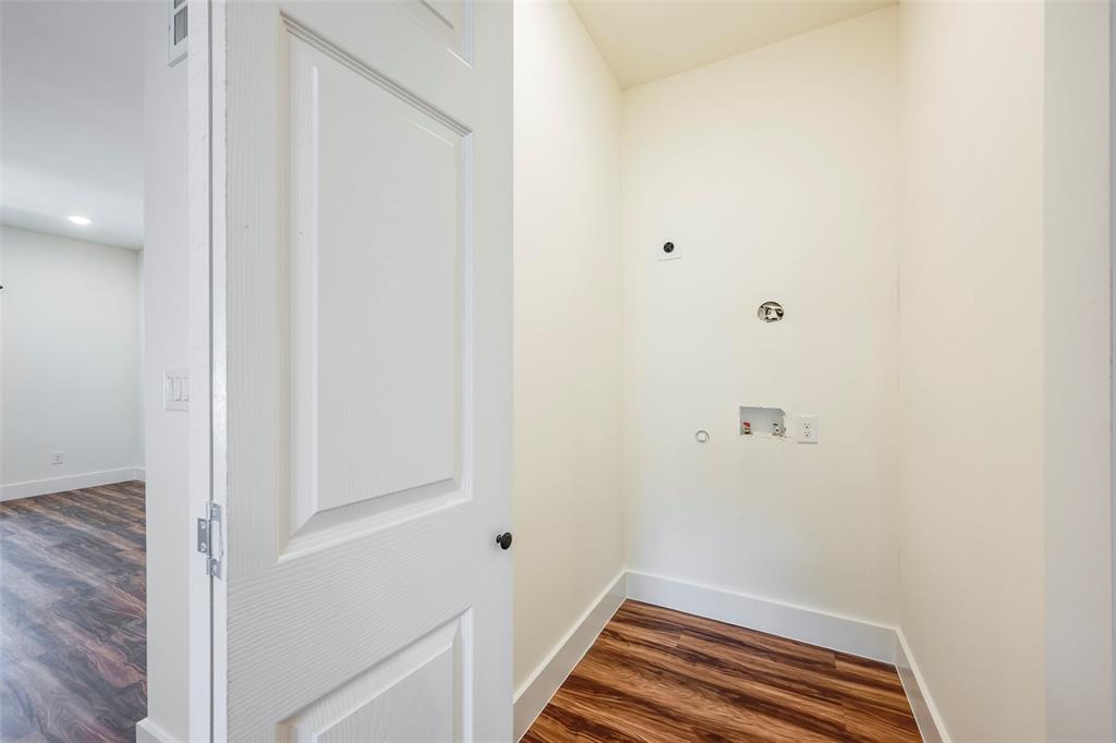 3523 Herrling Street Dallas, TX 75210 - Photo 6 of 14 Washroom featuring electric dryer hookup, dark wood-style flooring, and washer hookup