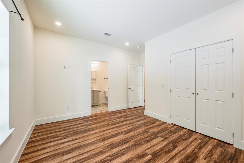 3523 Herrling Street Dallas, TX 75210 - Photo 8 of 14 Unfurnished bedroom featuring wood finished floors, recessed lighting, a closet, and ensuite bathroom