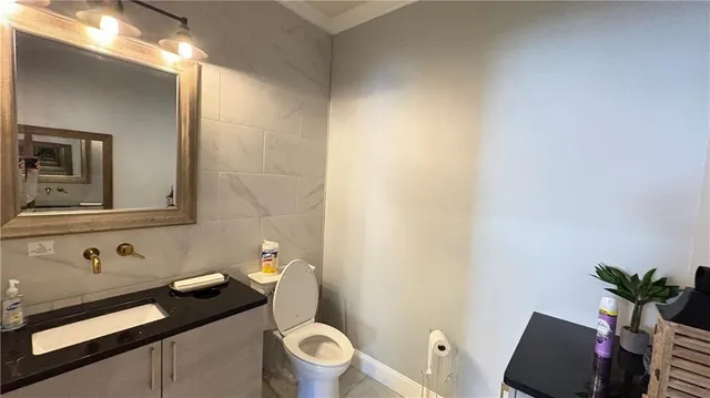 a bathroom with a sink and toilet