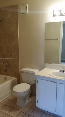 a view of house with backyard