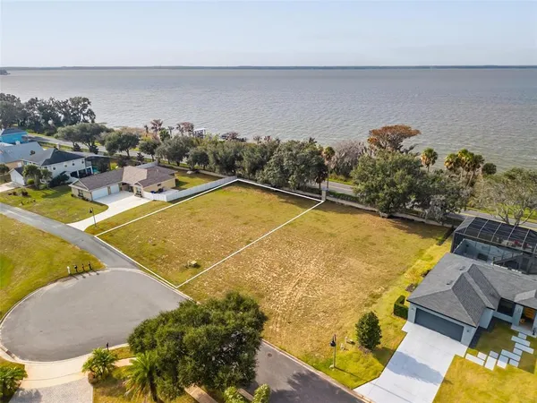 an aerial view of a house with a swimming pool