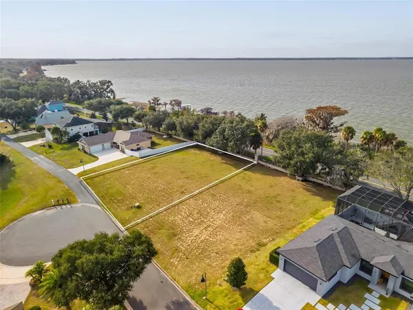 an aerial view of a house with a swimming pool
