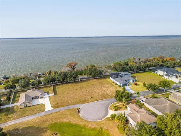 an aerial view of a house with a ocean view