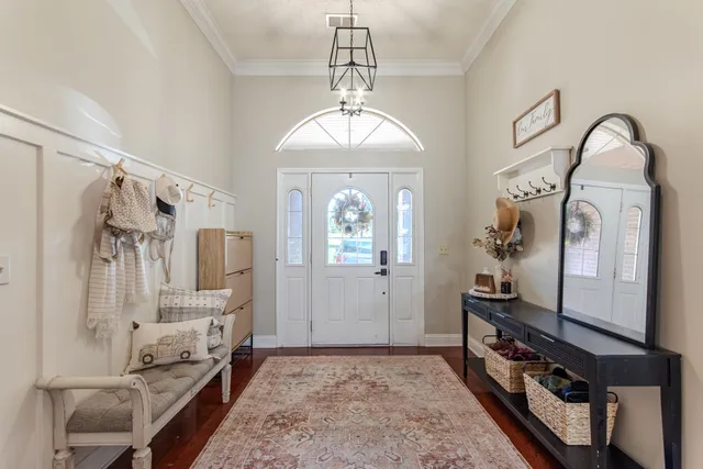 a view of an entryway with wooden floor