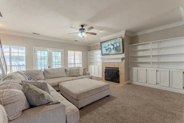 a living room with furniture and a fireplace