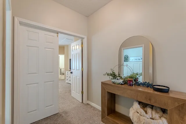 a room with two mirror and furniture