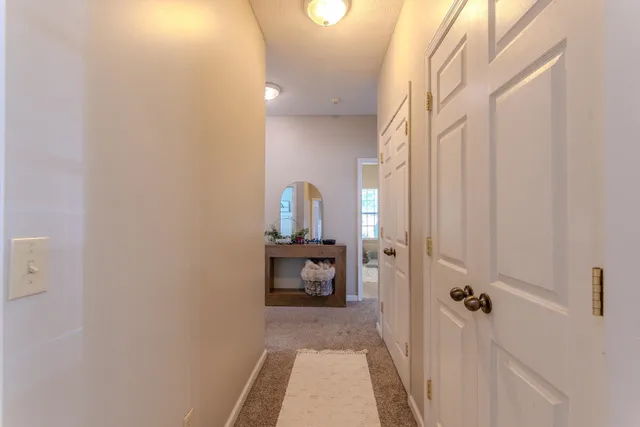 a view of a bathroom from the hallway