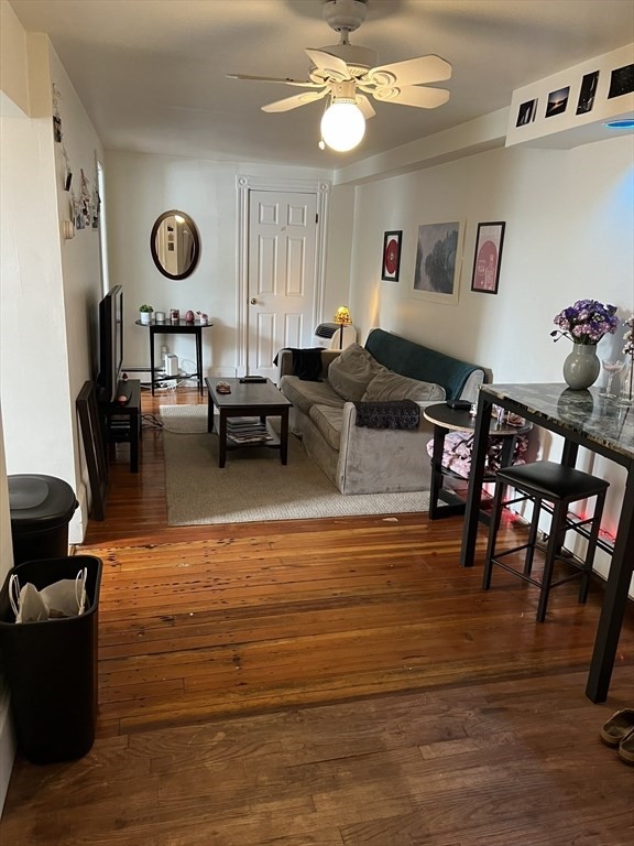 137 Peterborough Street, Unit 31 Boston, MA 02215 - Photo 4 of 14 a living room with furniture and wooden floor