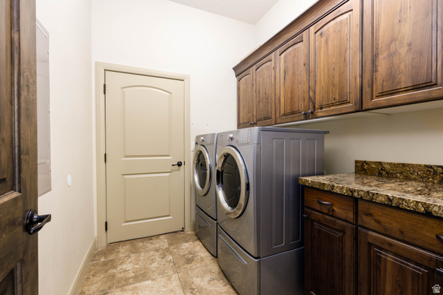 2005 West 450 S Circle St. George, UT 84770 - Photo 18 of 57 Laundry room featuring tile flooring, dark wood cabinetry, and a stone countertop