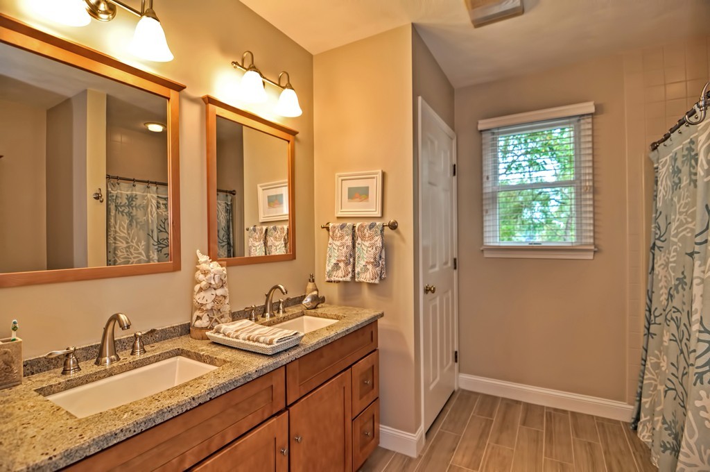 4 Nottingham Way Stoneham, MA 02180 - Photo 21 of 30 a bathroom with 2 sink and a mirror