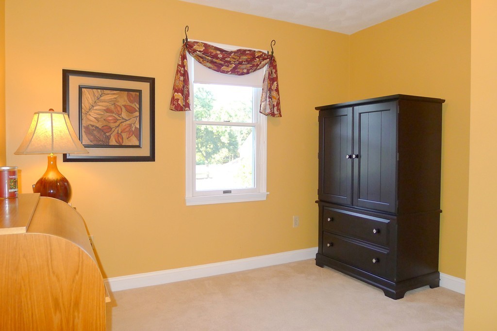 4 Nottingham Way Stoneham, MA 02180 - Photo 24 of 30 a view of a closet with wooden floor