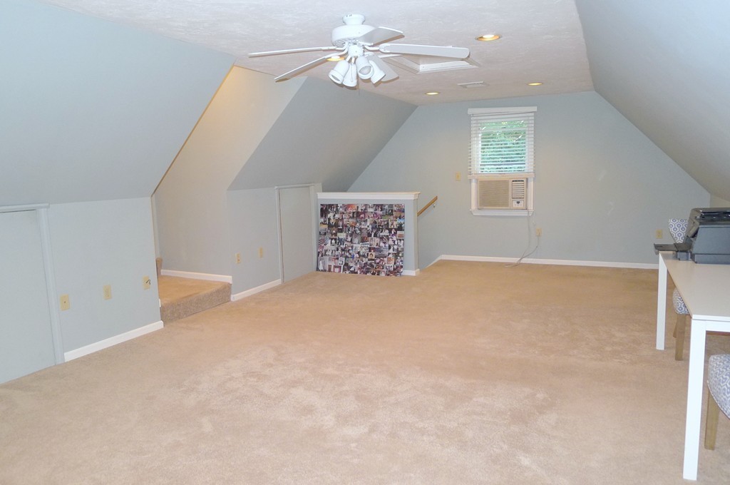 4 Nottingham Way Stoneham, MA 02180 - Photo 26 of 30 an empty room with windows and fan