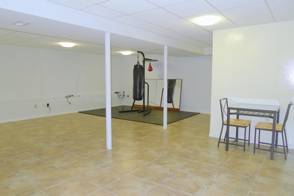 4 Nottingham Way Stoneham, MA 02180 - Photo 27 of 30 a view of a room with gym equipment