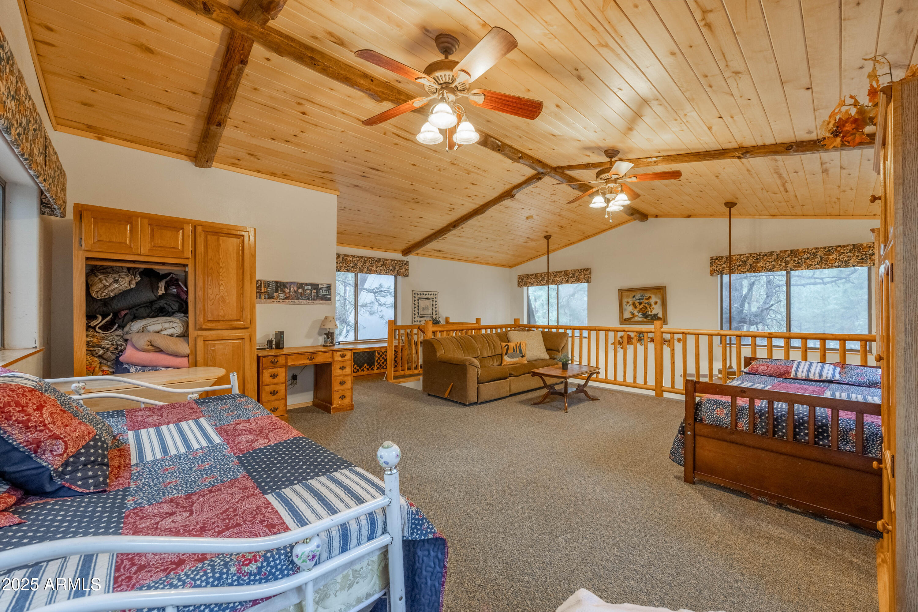 1643 Rifle Way Forest Lakes, AZ 85931 - Photo 15 of 40 a bedroom with furniture and a chandelier