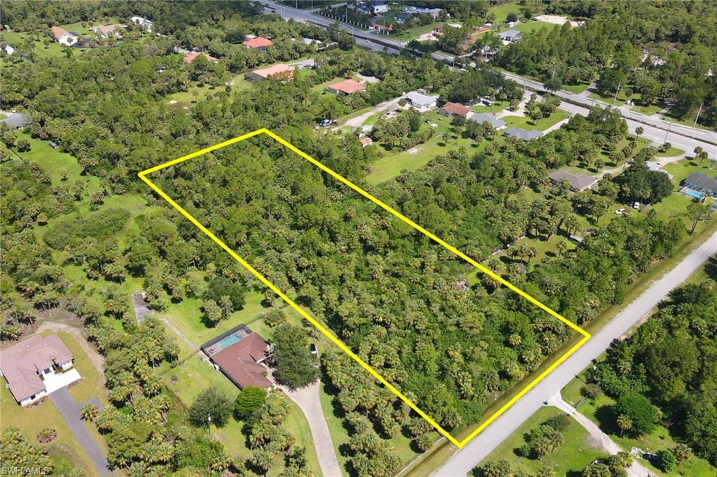 121 15th Street Southwest Naples, FL 34117 - Photo 3 of 8 an aerial view of a tennis court