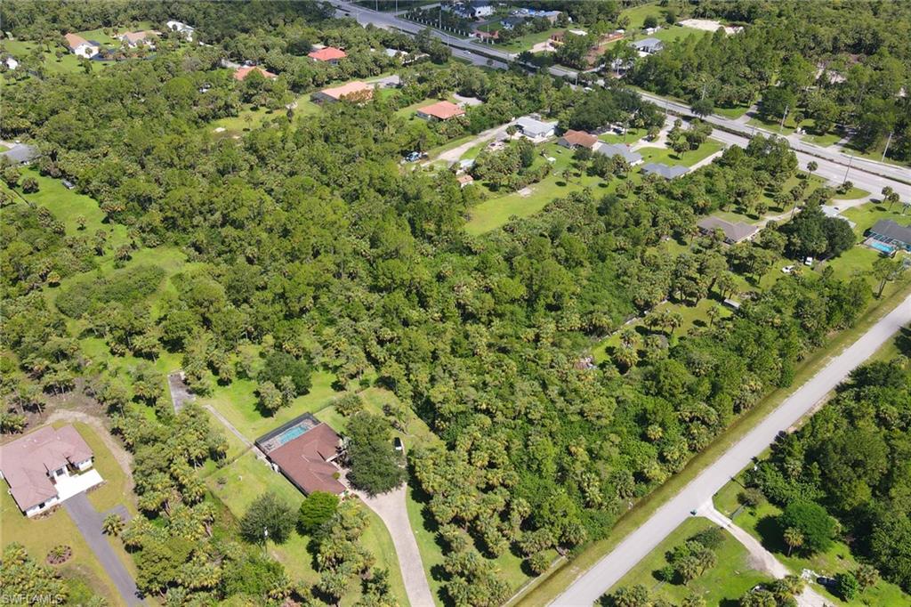 121 15th Street Southwest Naples, FL 34117 - Photo 6 of 8 an aerial view of a residential houses with yard
