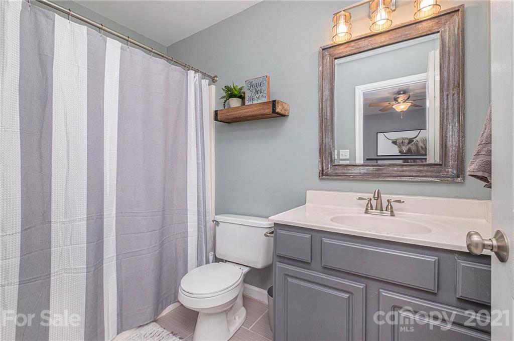 6107 Stack Road Monroe, NC 28112 - Photo 16 of 24 a bathroom with a toilet sink and mirror