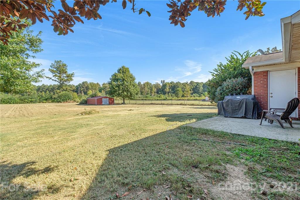 6107 Stack Road Monroe, NC 28112 - Photo 19 of 24 a view of a lake with a yard